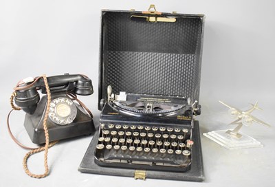 Lot 238 - A Vintage Remington typewriter, together with...