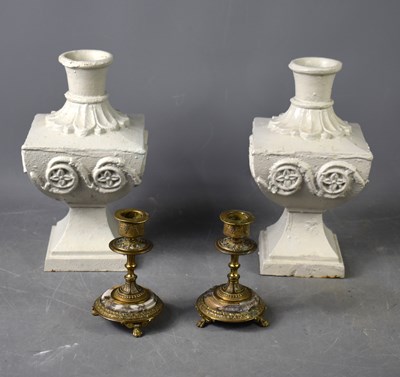 Lot 112a - A pair of painted cast iron candle sticks of...