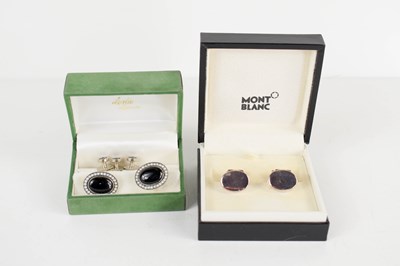 Lot 134 - A pair of silver cufflinks, the oval heads...