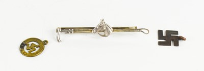 Lot 140 - A silver plated tie pin, the front with a...