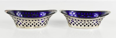 Lot 141 - A pair of silver and blue glass lined salts,...