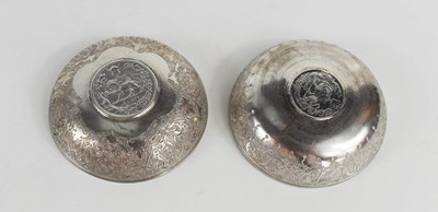 Lot 142 - A pair of white metal decorative dishes, each...
