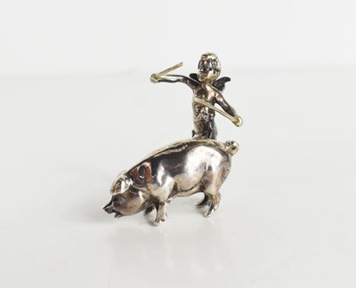 Lot 447 - A solid silver model pig and cherub group, 4cm...