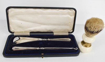 Lot 137 - A silver handled button hook and shoe horn set,...