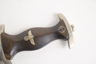 Lot 200 - A WWII German SS dagger and scabbard, the...