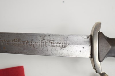 Lot 200 - A WWII German SS dagger and scabbard, the...