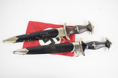 Lot 200 - A WWII German SS dagger and scabbard, the...