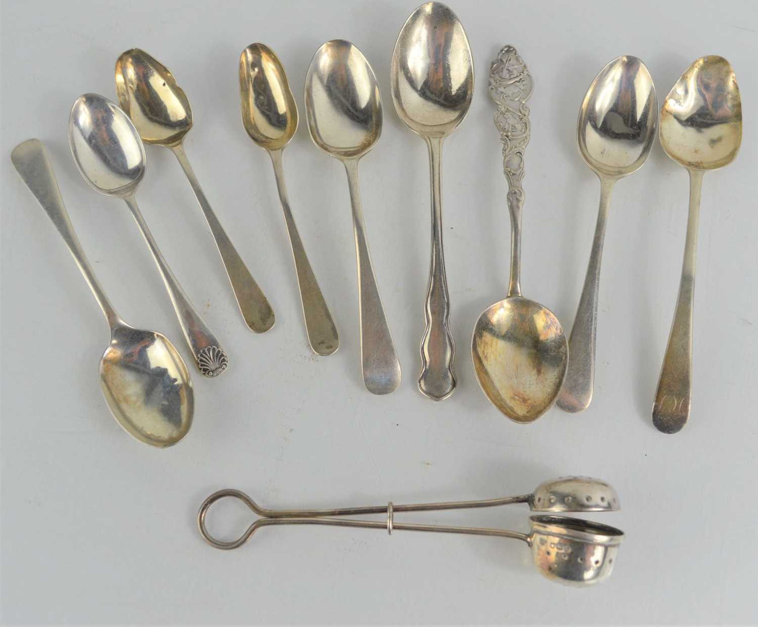 Lot 248 - A silver tea strainer and nine silver...