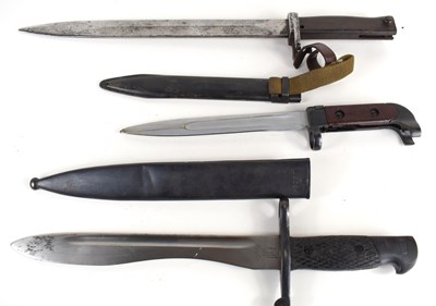 Lot 174 - Three military bayonets, two with metal...