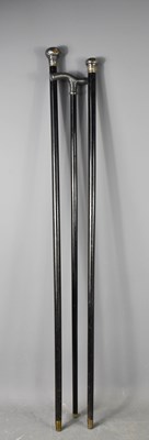 Lot 226 - Three antique ebonised walking canes, two with...