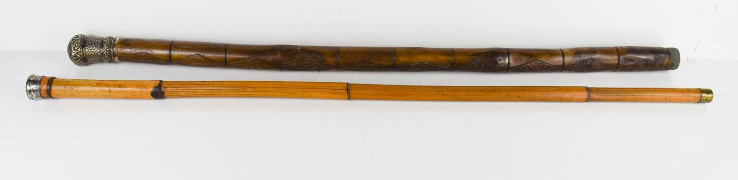 Lot 215 - Two antique walking canes with silver plated...