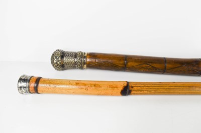 Lot 215 - Two antique walking canes with silver plated...