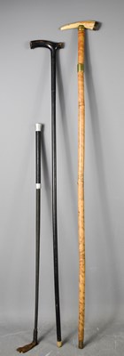 Lot 207 - Two antique walking canes and a whip, one...