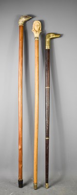 Lot 209 - Three vintage walking canes, one having a...