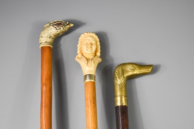 Lot 209 - Three vintage walking canes, one having a...