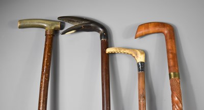 Lot 211 - Four vintage walking canes, three with horn...