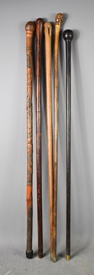 Lot 213 - A group of five vintage walking canes of...