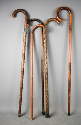 Lot 214 - A group of five vintage walking sticks of...