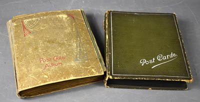 Lot 111 - Two albums of Edwardian and later postcards...