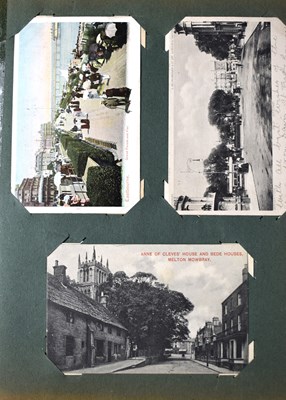 Lot 111 - Two albums of Edwardian and later postcards...
