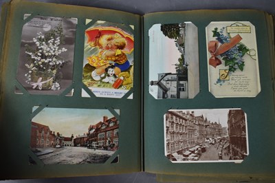 Lot 111 - Two albums of Edwardian and later postcards...