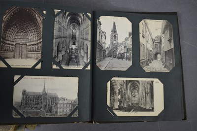 Lot 111 - Two albums of Edwardian and later postcards...