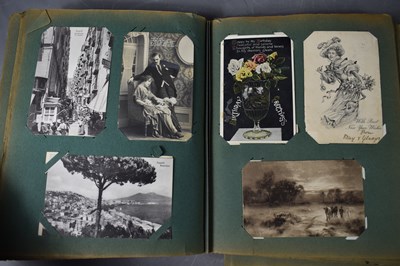 Lot 111 - Two albums of Edwardian and later postcards...