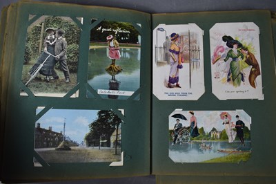 Lot 111 - Two albums of Edwardian and later postcards...