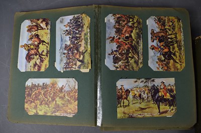 Lot 111 - Two albums of Edwardian and later postcards...