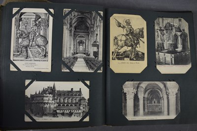 Lot 111 - Two albums of Edwardian and later postcards...