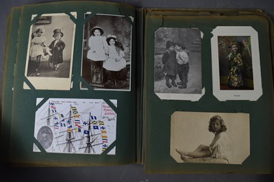Lot 111 - Two albums of Edwardian and later postcards...