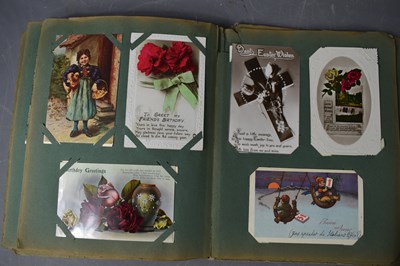Lot 111 - Two albums of Edwardian and later postcards...