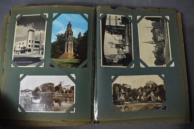 Lot 111 - Two albums of Edwardian and later postcards...
