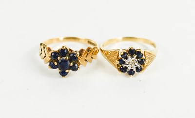 Lot 236 - A 9ct gold and sapphire flower head ring, with...