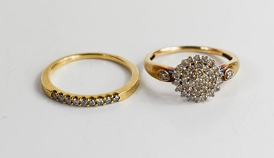 Lot 102 - A 9ct gold and diamond cluster ring, set with...