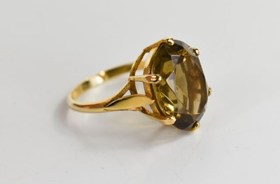 Lot 65 - A 9ct gold and smoky quartz dress ring, the...