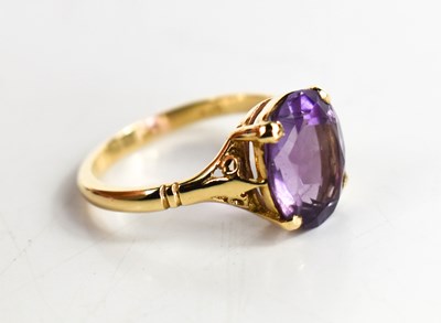 Lot 66 - A 9ct gold and amethyst dress ring, the oval...