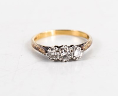 Lot 115 - A 9ct gold and diamond three stone ring, the...