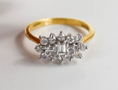 Lot 139 - An 18ct gold and diamond dress ring, the...