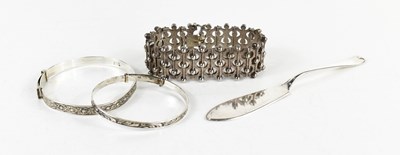 Lot 186 - A modernist silver bracelet of abstract bark...