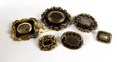 Lot 106 - A group of six 19th century mourning brooches,...