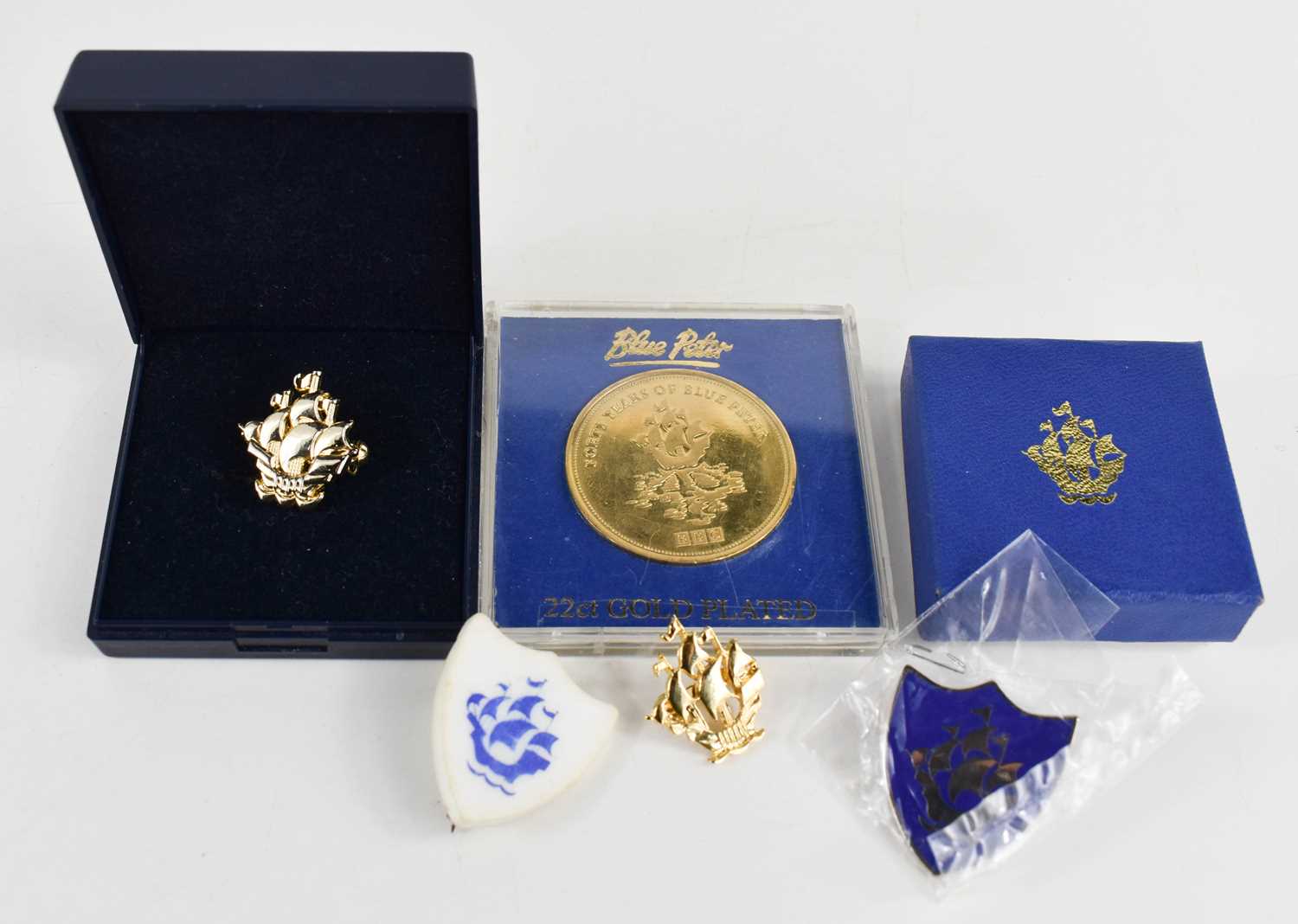 Lot 309 - A group of Blue Peter badges to include a gold...