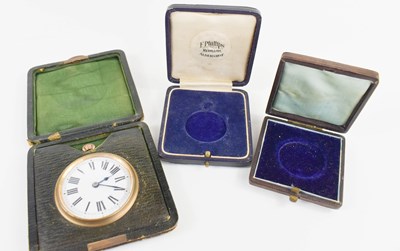 Lot 262 - A leather cased travel clock, early 20th...