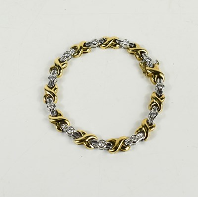 Lot 149 - A 14ct white and yellow gold bracelet, with...