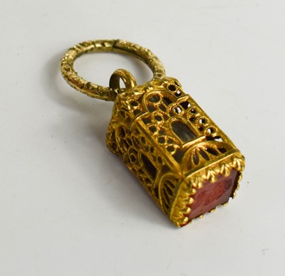 Lot 228 - A gilt metal reliquary pendant seal, the cut...