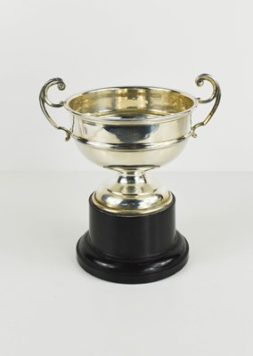 Lot 454 - A silver twin handled trophy raised on an...