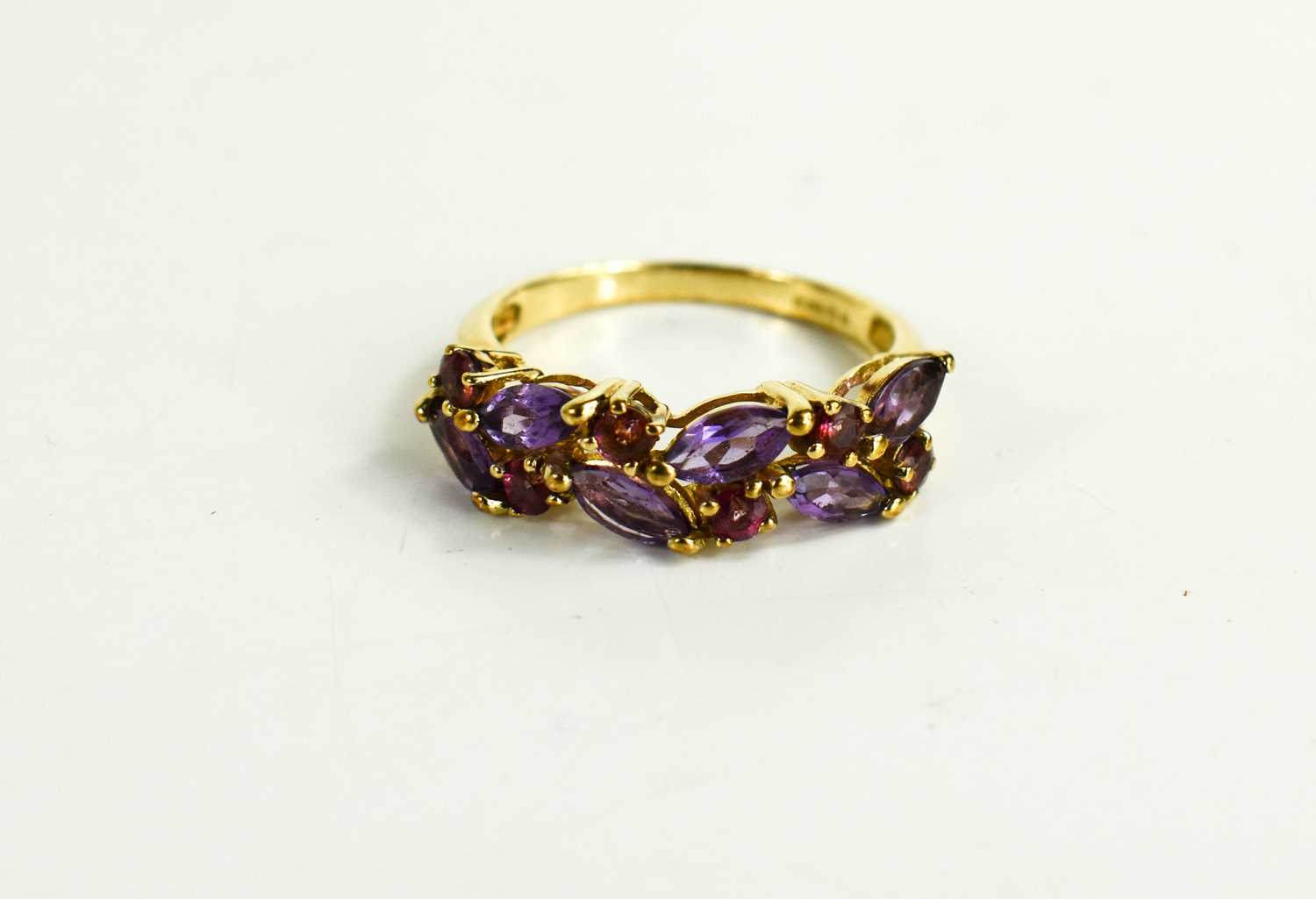 Lot 37 - A 9ct gold, amethyst and ruby set dress ring,...