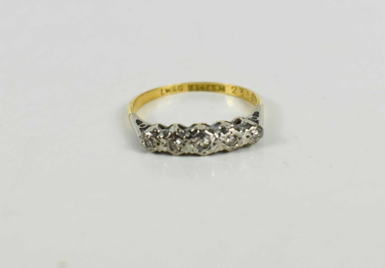 Lot 43 - An 18ct gold, platinum and diamond ring, the...