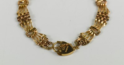 Lot 41 - A 9ct gold gate link bracelet, with heart form...