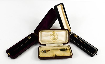 Lot 130 - A gold (testing as) pearl and garnet set hat...